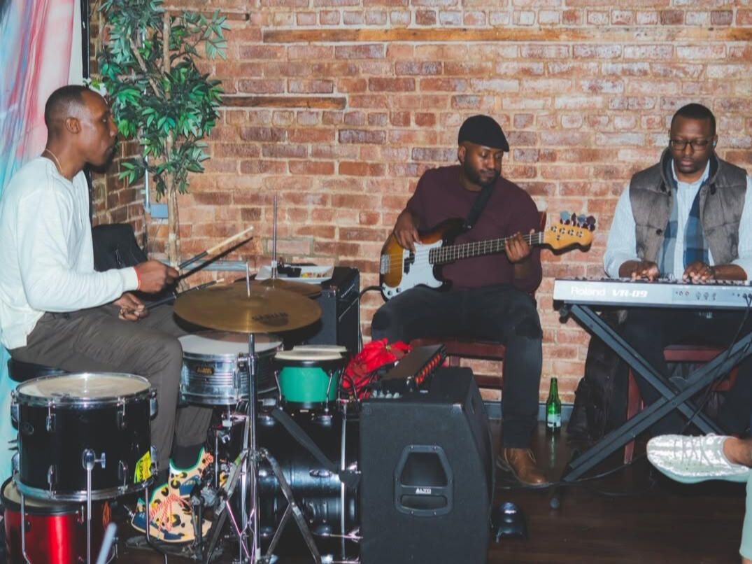 BreaknRecords Band performing live: drums, bass, and keys