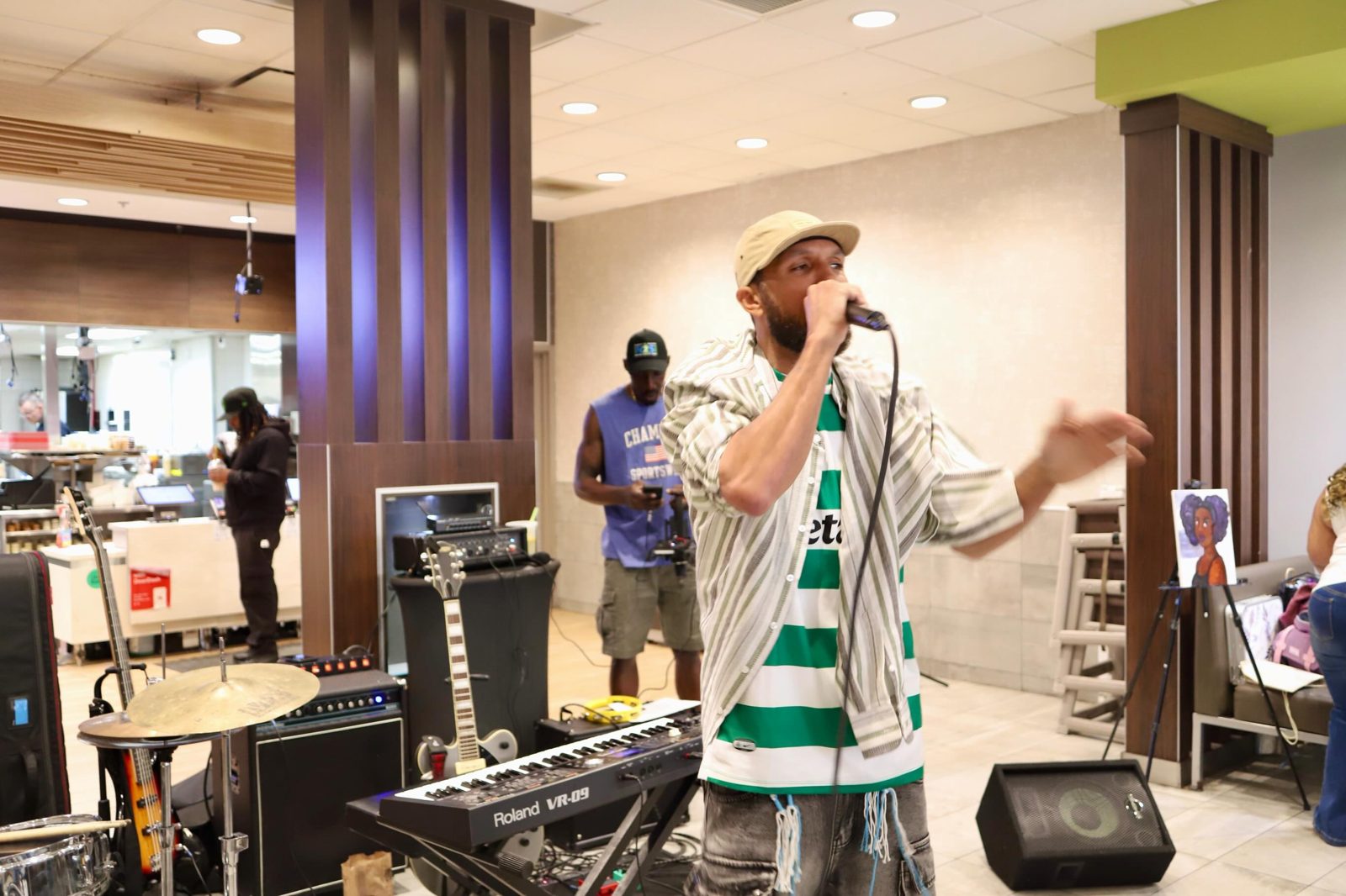 A rapper performing live at a BreaknRecords open mic