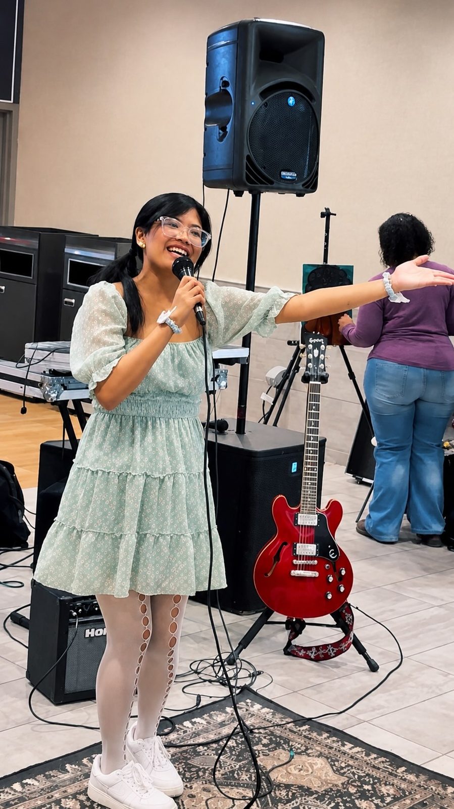 A singer performing at an open mic